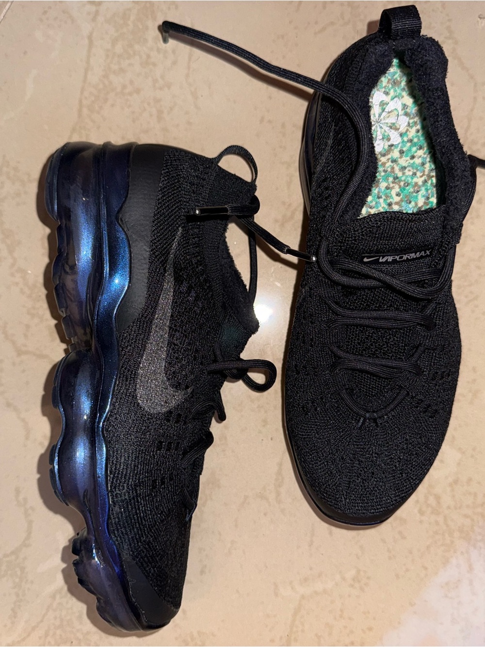 Nike Kids Black Sneakers with Iridescent Blue Sole